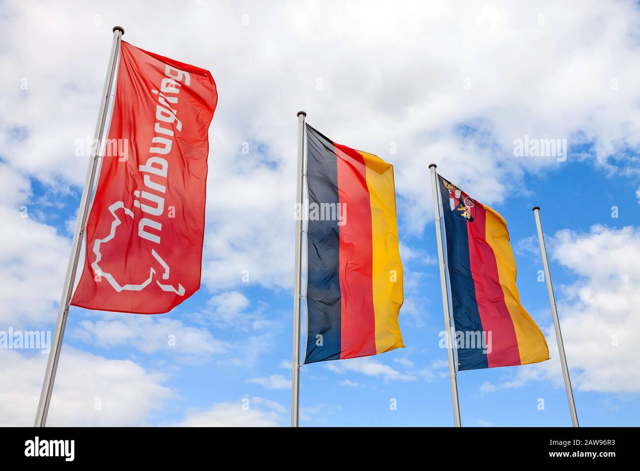 Nurburg, Germany - May 20, 2017: Flag at race track Nurburgring, labeled with 'Nurburgring' and logo, two german flags at pole Stock Photo