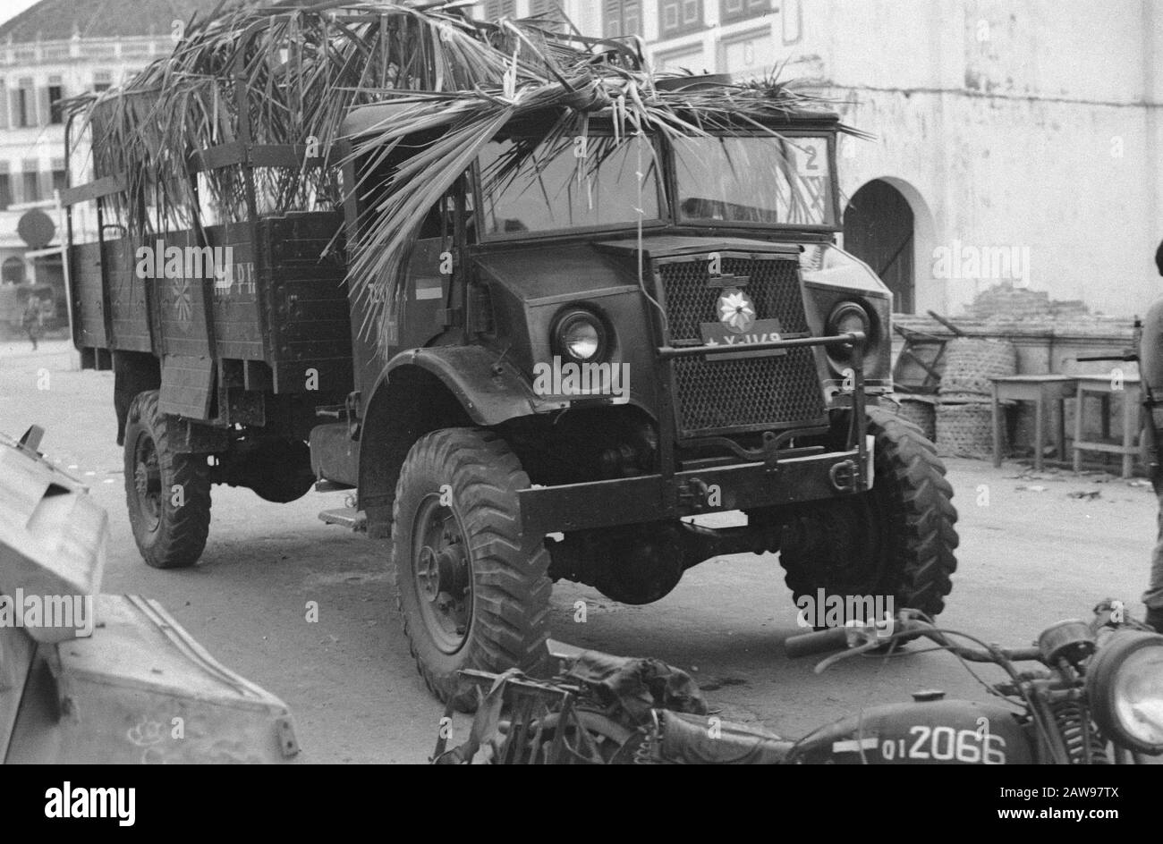 Loeboek Pakem and Baoengan description: Military truck camouflaged with palm branches Date: July 29, 1948 Location: Indonesia, Dutch East Indies, Sumatra Stock Photo