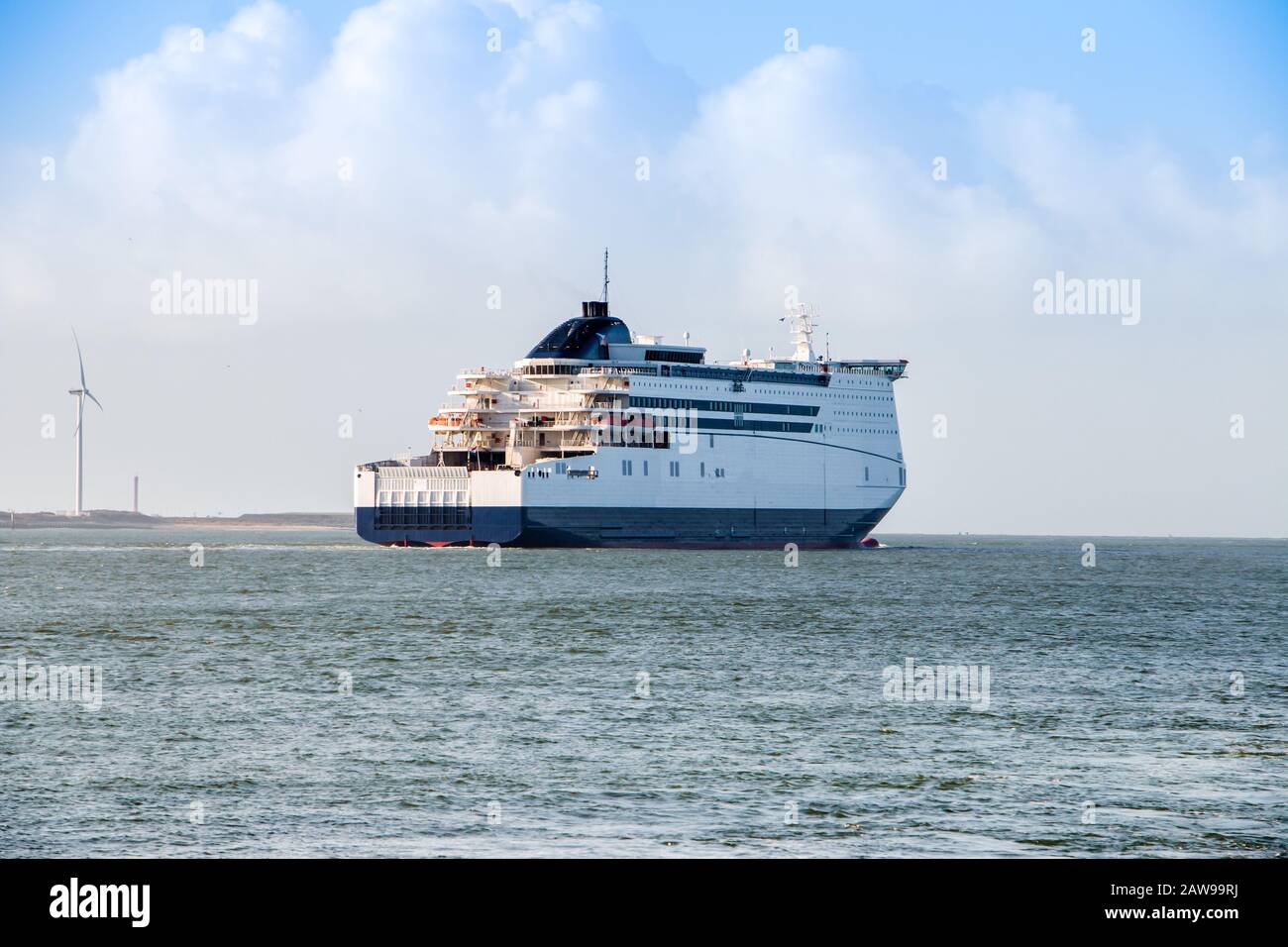 View of the river 'the new waterway' in winter, near Hoek van Holland with cargo ships, a frequently used industrial shipping route in South Holland Stock Photo
