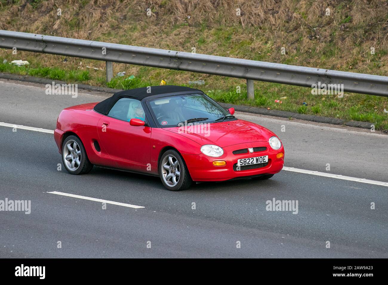 1998 red MG MGF 1.8i VVC; UK Vehicular traffic, transport, modern, saloon cars, on the M61 motorway highway. UK Stock Photo
