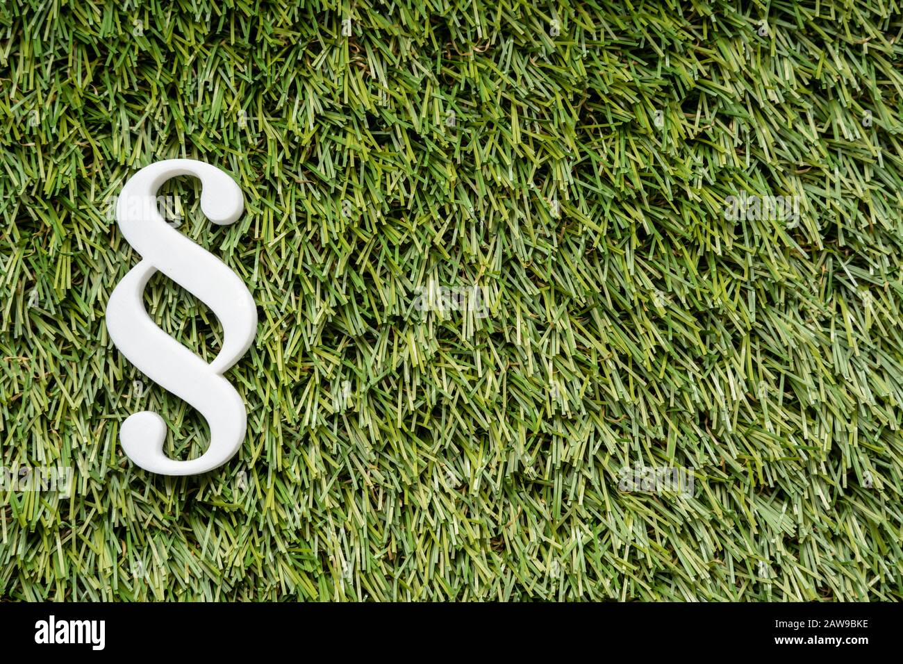 Photo Of Paragraph Sign On Green Grass Lawn Stock Photo