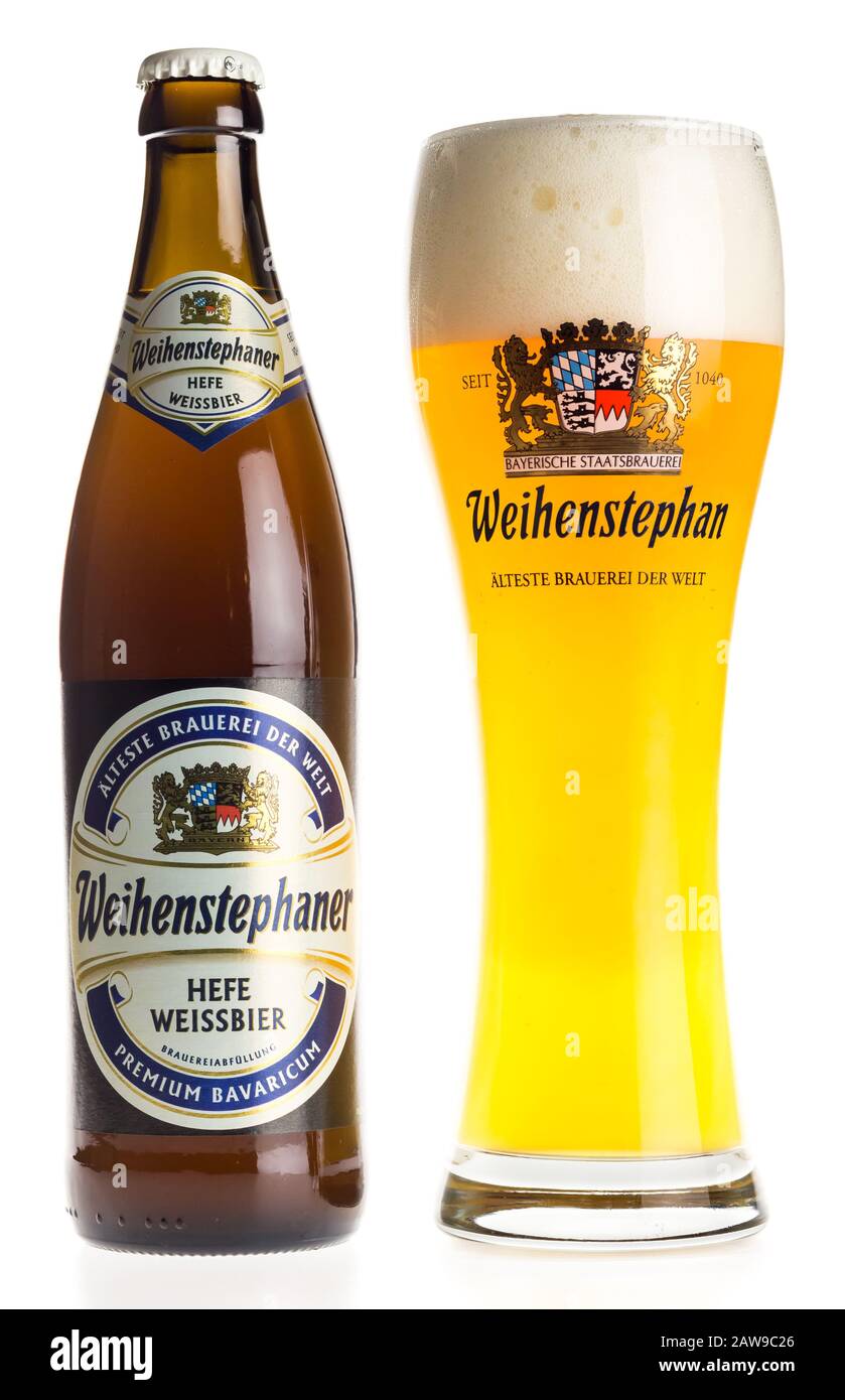 Bottle and glass of german Weihenstephaner wheat beer isolated on a