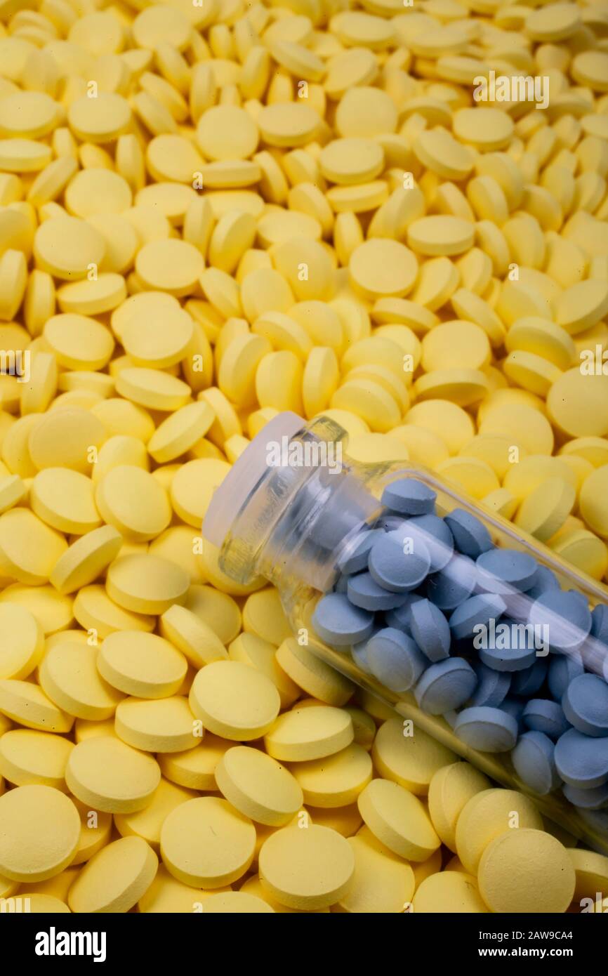 Download Jar Of Blue Pills Lies On Yellow Medicines Drugs Painkillers Colds Macro Stock Photo Alamy Yellowimages Mockups