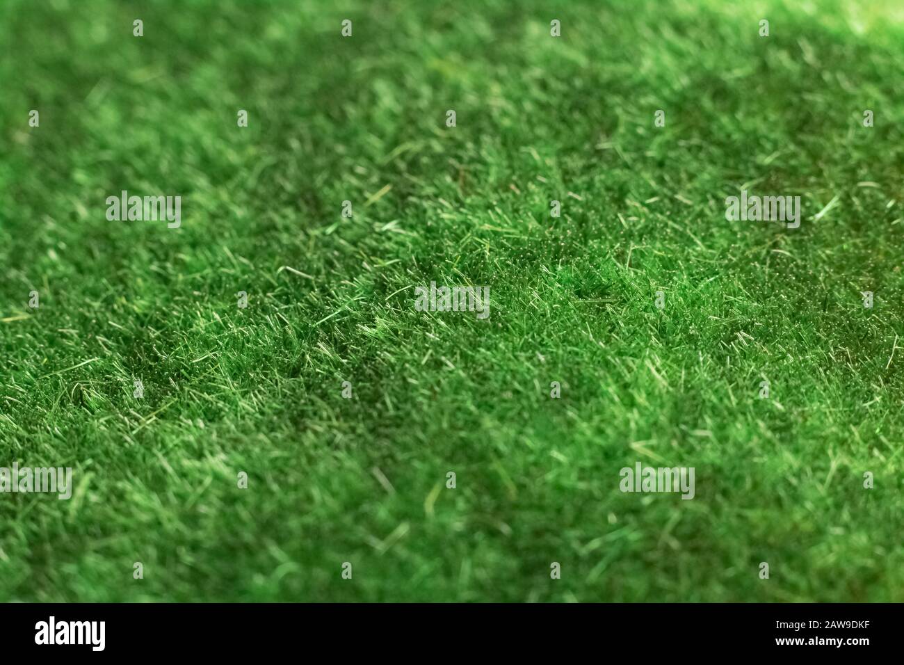 Artificial green grass closeup, background or texture Stock Photo - Alamy