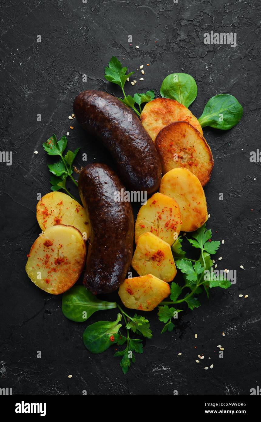 Baked sausages with buckwheat and blood. Top view. Free space for your