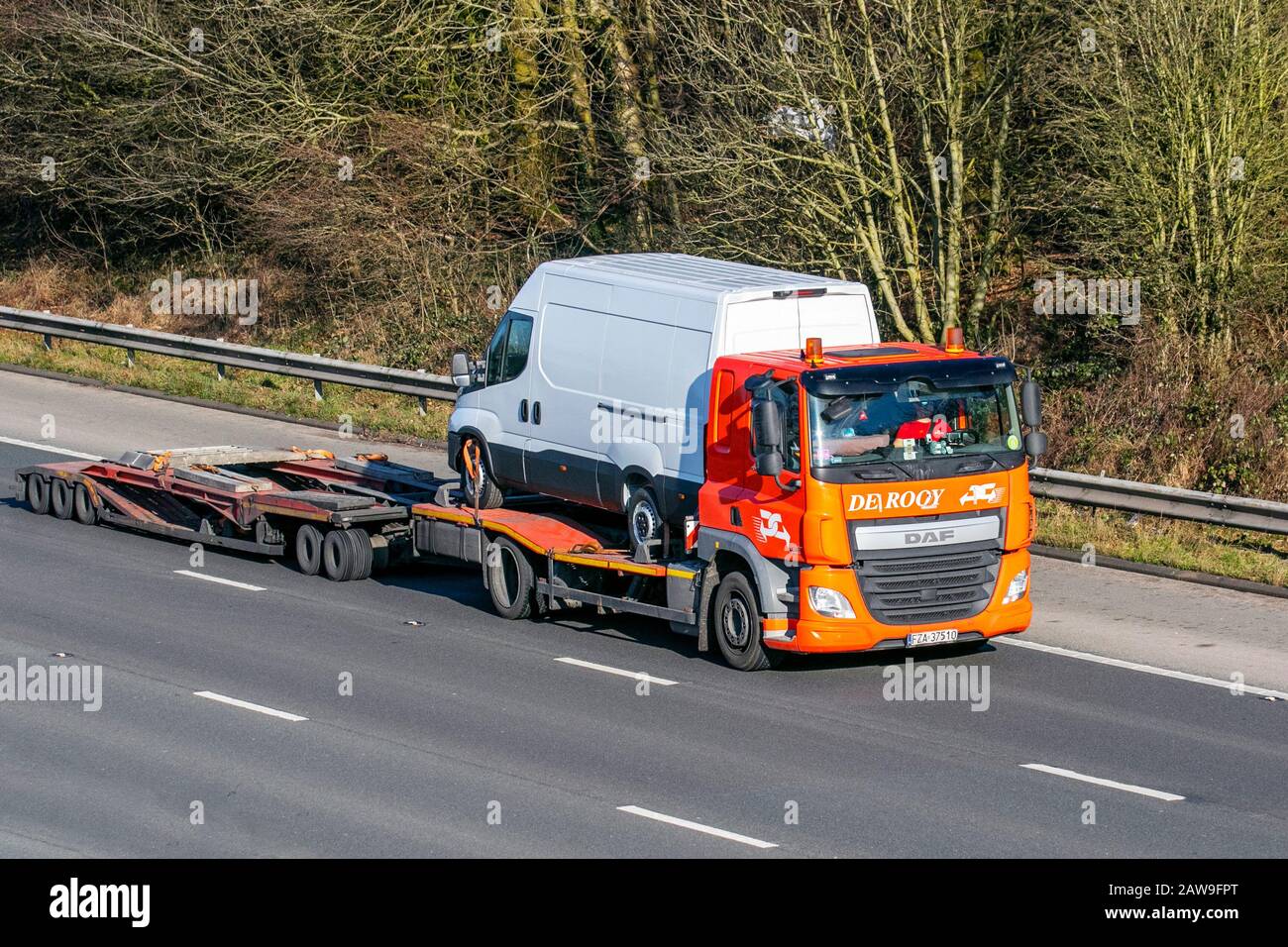 De Rooy Leyland Haulage delivery trucks, lorry, transportation, truck, cargo carrier, DAF vehicle, European commercial transport, industry, M61 at Manchester, UK Stock Photo