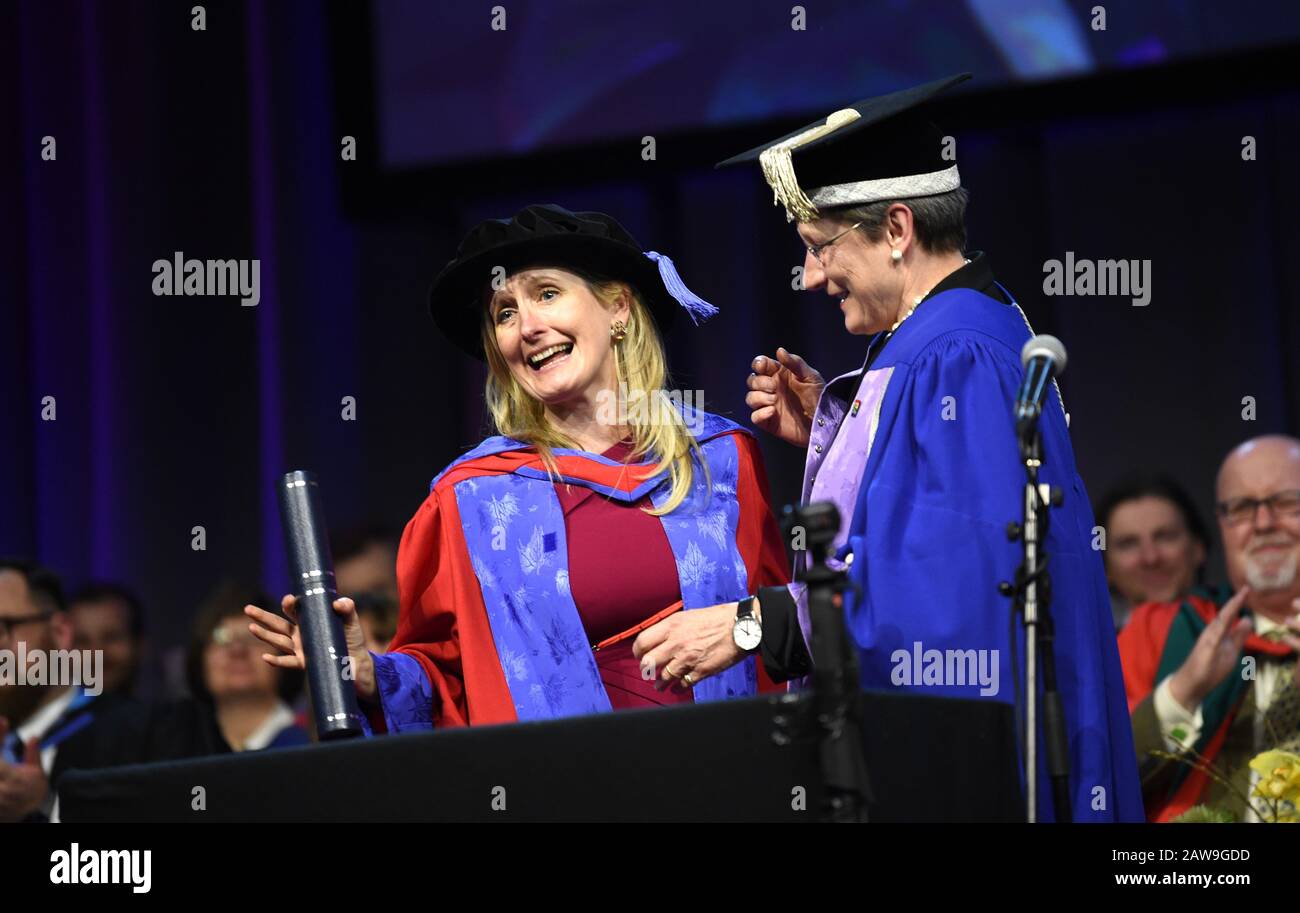 Brighton UK 7th February 2020 - Childrens author Cressida Cowell (left) known for her series of books 'How to Train Your Dragon receives an Honorary Doctorate of Arts at the University of Brighton Graduation Ceremony from Vice-Chancellor Prof Debra Humphris this afternoon: Credit Simon Dack / Alamy Live News Stock Photo