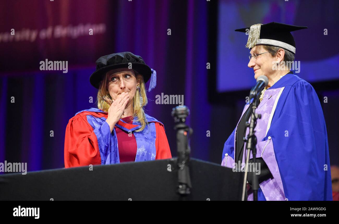 Brighton UK 7th February 2020 - Childrens author Cressida Cowell (left) known for her series of books 'How to Train Your Dragon receives an Honorary Doctorate of Arts at the University of Brighton Graduation Ceremony from Vice-Chancellor Prof Debra Humphris this afternoon: Credit Simon Dack / Alamy Live News Stock Photo