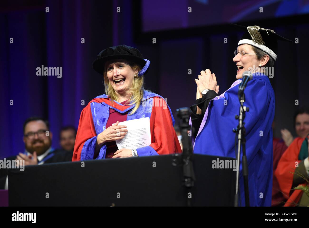 Brighton UK 7th February 2020 - Childrens author Cressida Cowell (left) known for her series of books 'How to Train Your Dragon receives an Honorary Doctorate of Arts at the University of Brighton Graduation Ceremony from Vice-Chancellor Prof Debra Humphris this afternoon: Credit Simon Dack / Alamy Live News Stock Photo