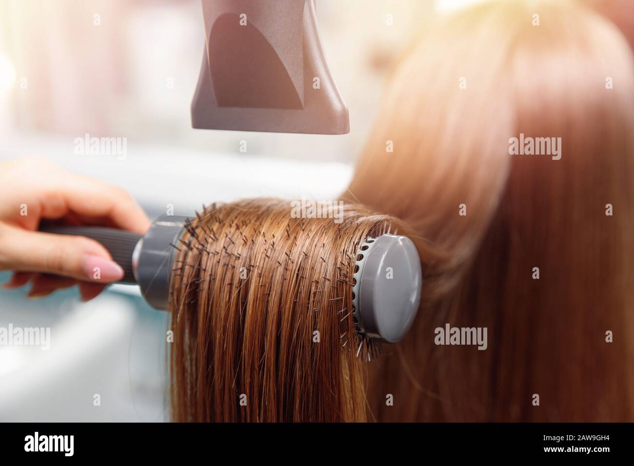 Hair blonde dryer round brush hi-res stock photography and images - Alamy