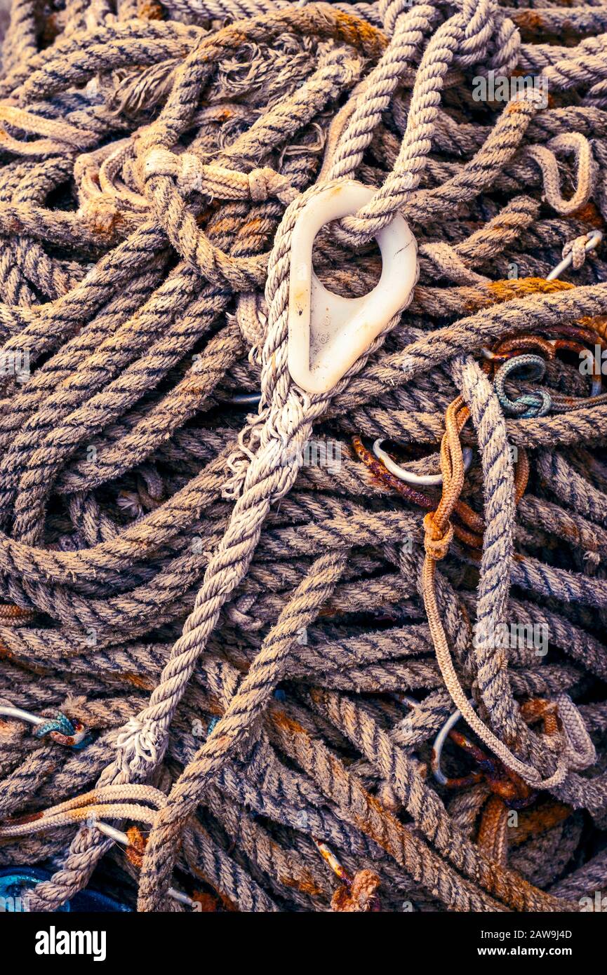 Spooled up and stowed line with standard rope thimble used for commercial fishing on Katlian street in Sitka, Alaska, USA Stock Photo