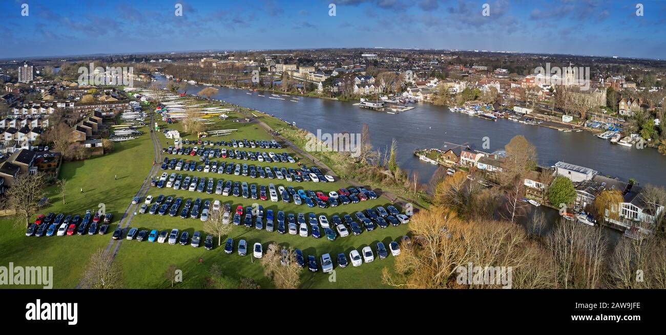 Cars and boats on Hurst Park for the Hampton Head rowing races on the River Thames. West Molesey, Surrey, England. Stock Photo