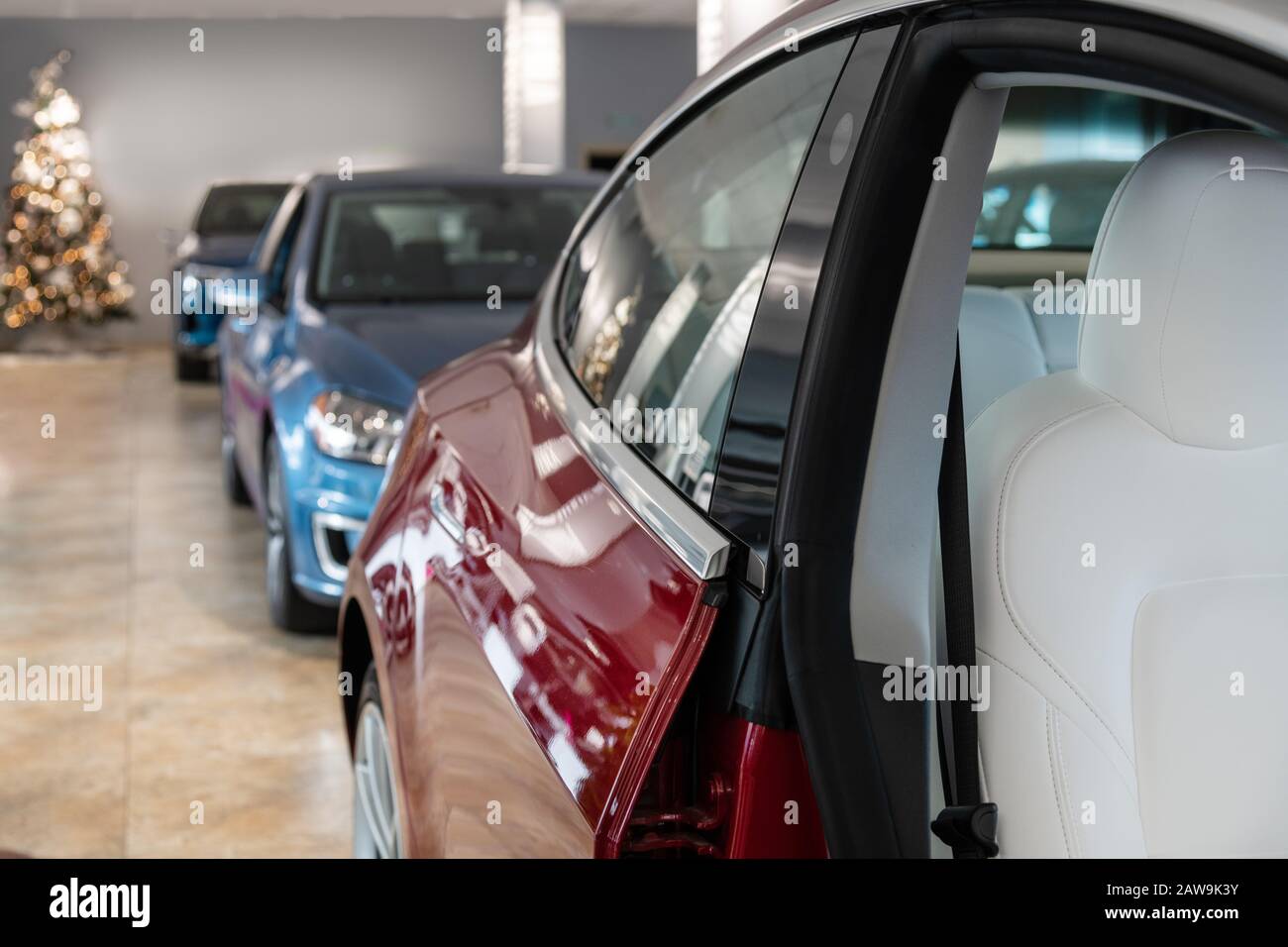 Brand new cars in dealer showroom Stock Photo