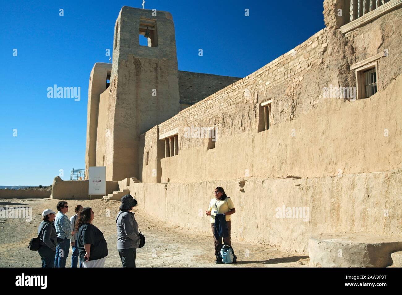 Tour guide and tourists at San Esteban del Rey Mission and Convento (1640), Sky City, Acoma Pueblo, New Mexico USA Stock Photo