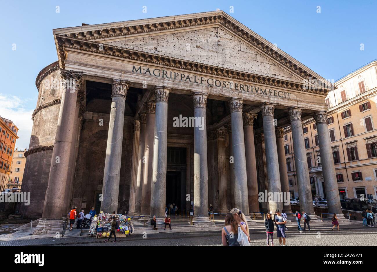 Tourists and guides in front of the Patheon in central Rome, Italy. The Pantheon is a former Roman temple and now a church completed in 126 AD Stock Photo