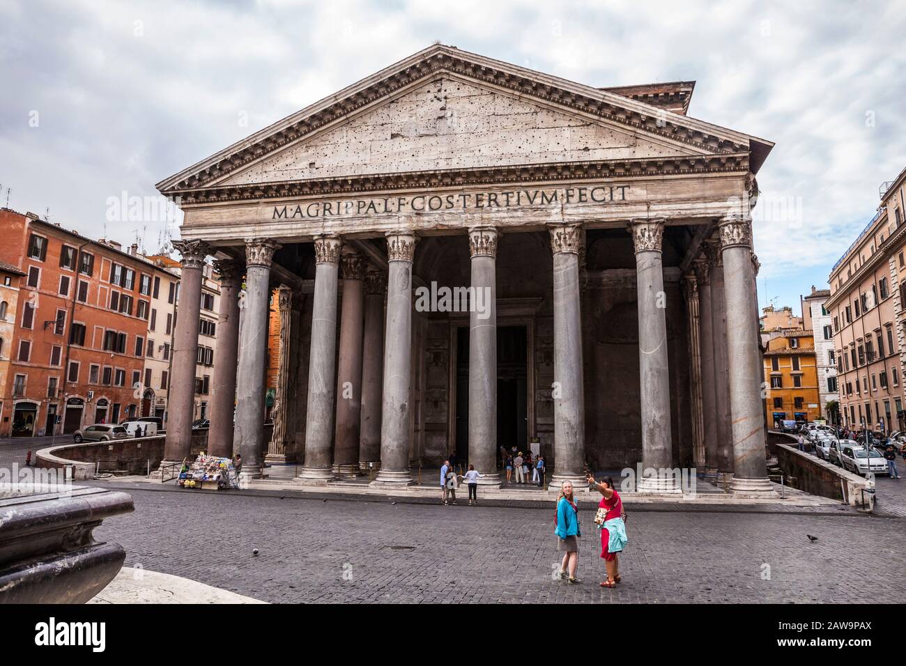 Tourists and guides in front of the Pantheon in central Rome, Italy. The Pantheon is a former Roman temple and now a church completed in 126 AD Stock Photo