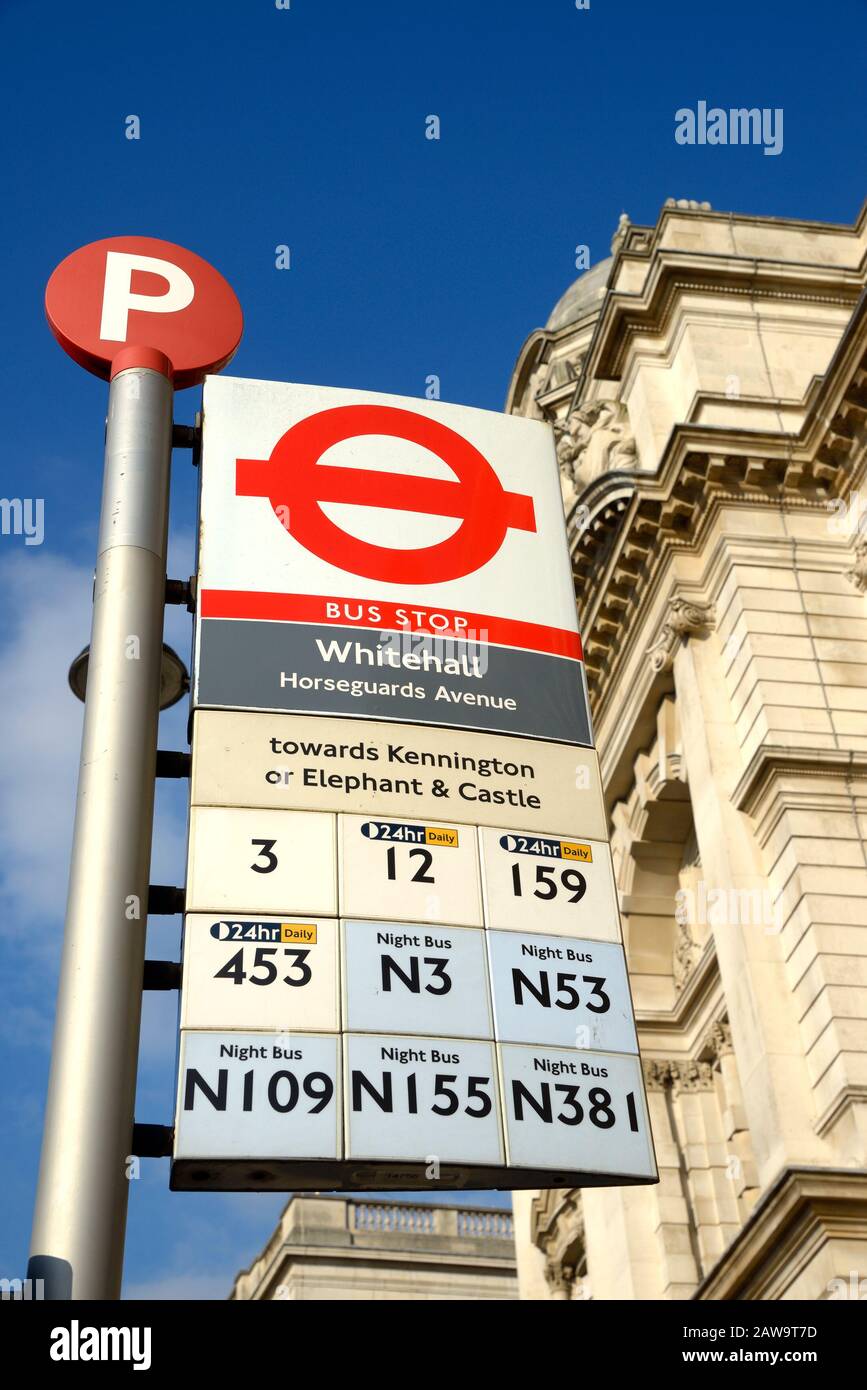 London, England, UK. Bus stop in Whitehall showing the routes Stock Photo