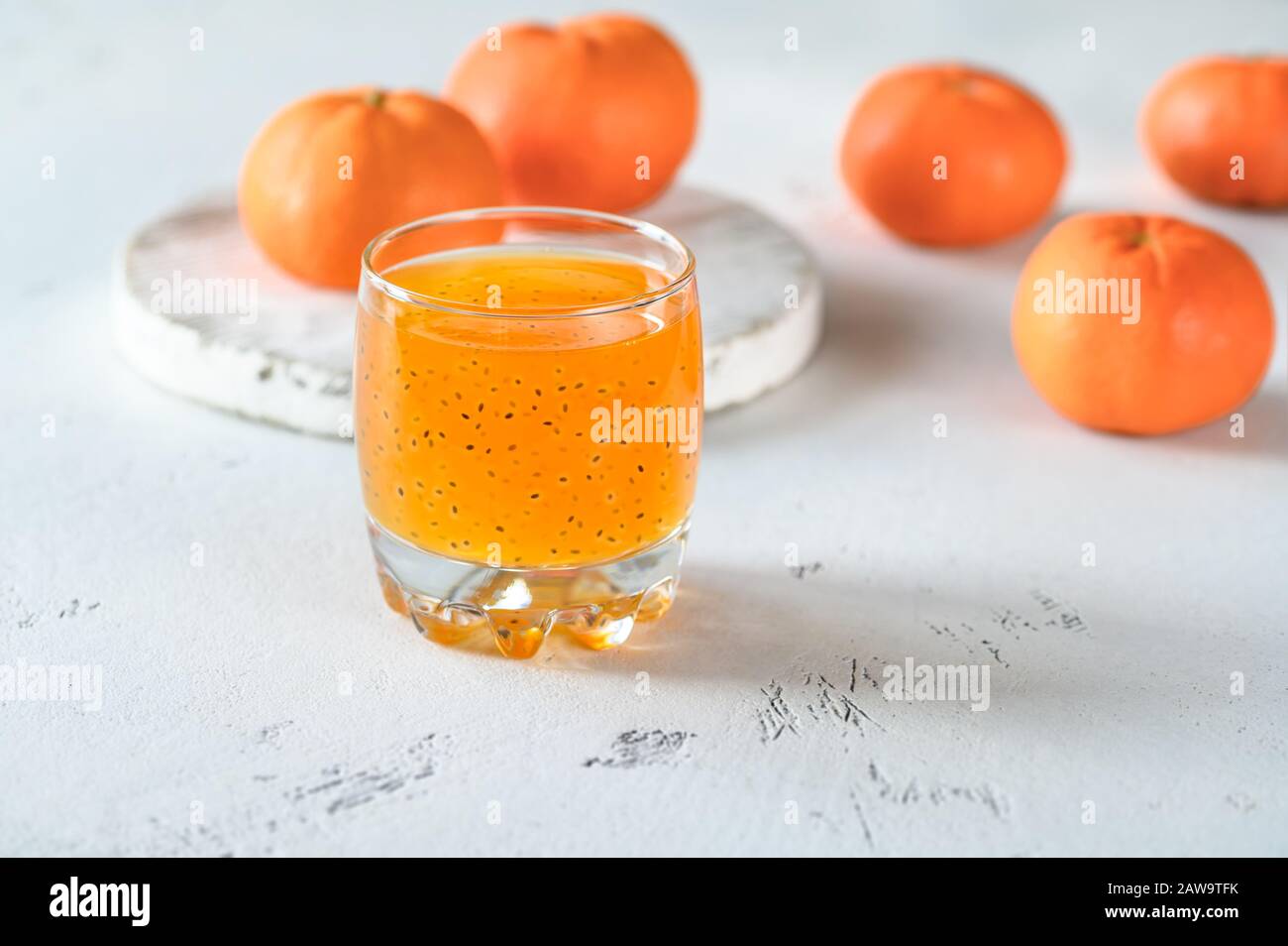 Glass of orange juice with basil seeds Stock Photo Alamy