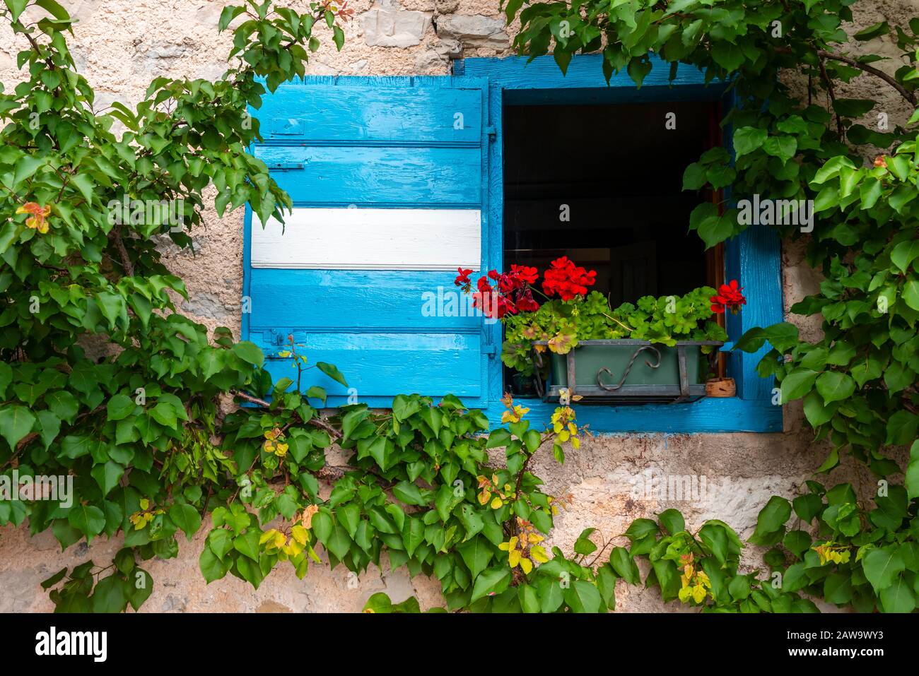 Blue and white shutter of a mountain hut, Rifugio San Marco, San Vito di Cadore, Belluno, Italy Stock Photo