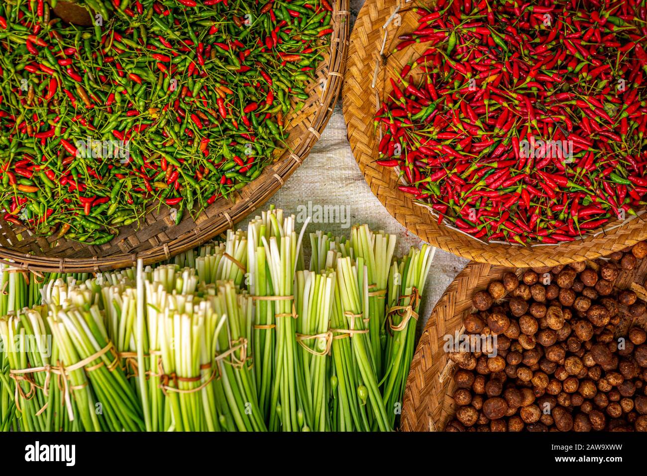 Freshly harvested spicy chili pepper and vegetables Stock Photo