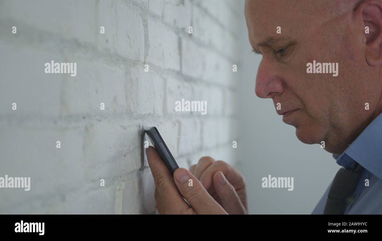 Image with a Disappointed Businessman Using a Cellphone Stock Photo