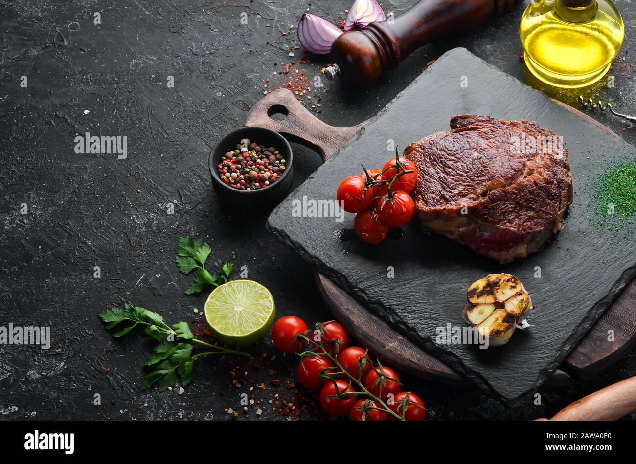 Grilled Ribeye Steak on the old background. Top view. free space for ...