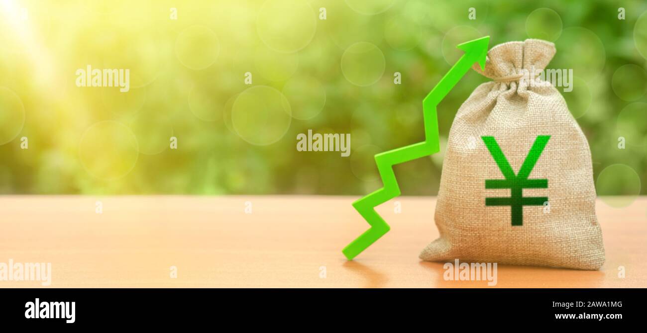 Yen yuan money bag and a green arrow up. Deposit interest rate rise. Economy accelerator. Performance increase. Strengthening of national currency, in Stock Photo