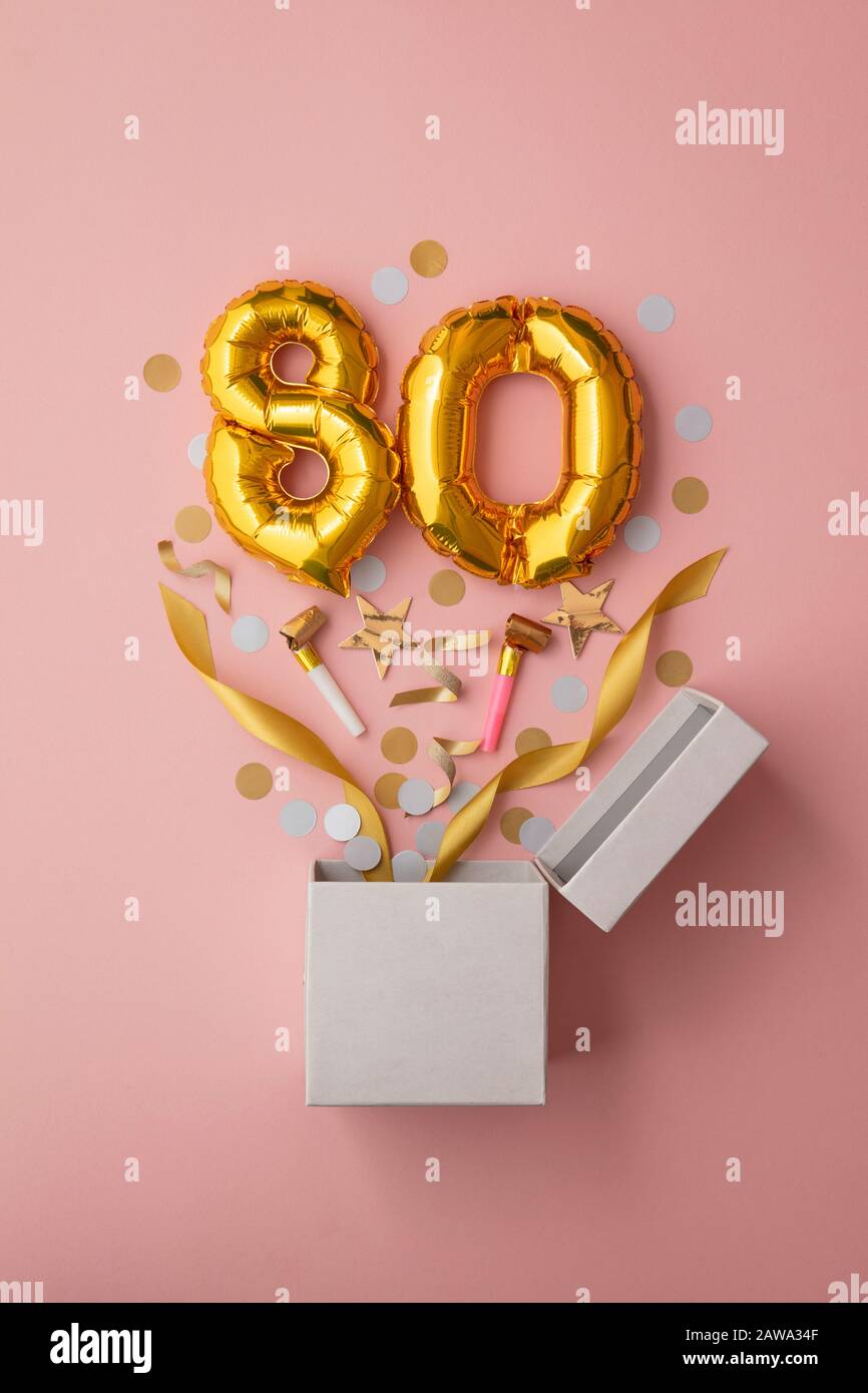 Number 80 birthday balloon celebration gift box lay flat explosion Stock Photo