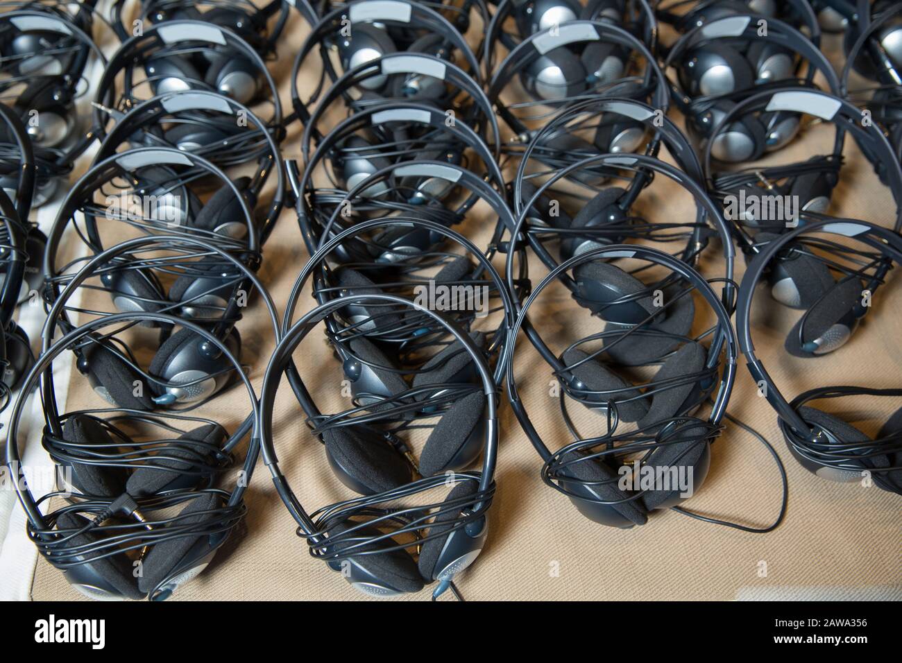 headphones used for simultaneous translation equipment simultaneous interpretation equipment . A set of headphones for simultaneous translation during Stock Photo
