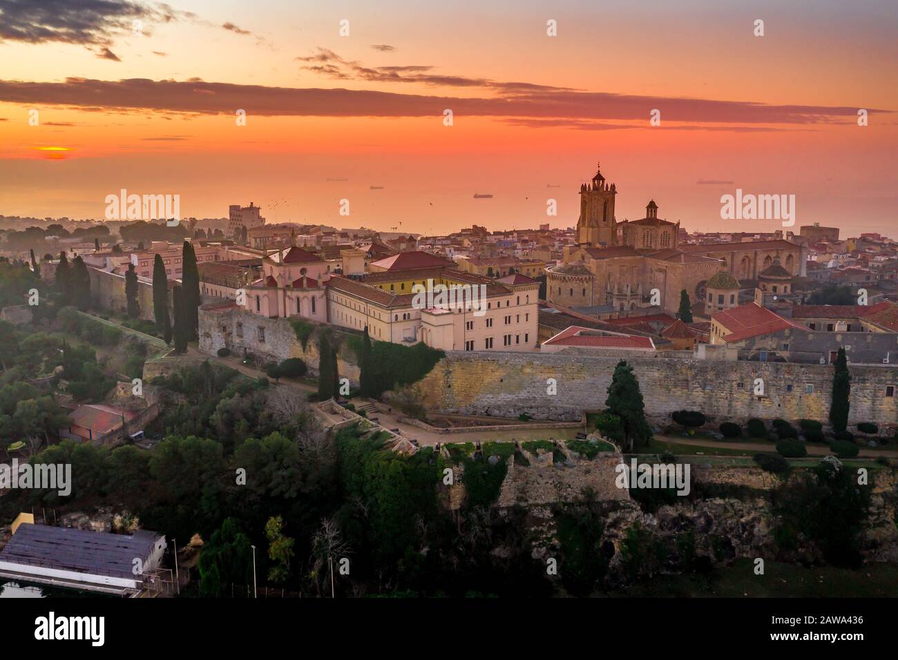 Aerial view of Tarragona Spain during sunrise with view of the Gothic cathedral city walls, bastions, Roman walls and other historic buildings Stock Photo