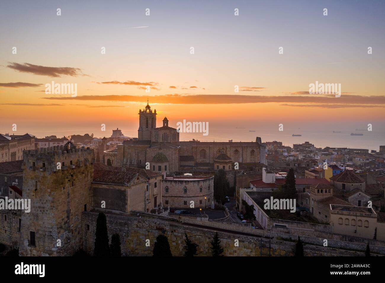 Aerial view of Tarragona Spain during sunrise with view of the Gothic cathedral city walls, bastions, Roman walls and other historic buildings Stock Photo