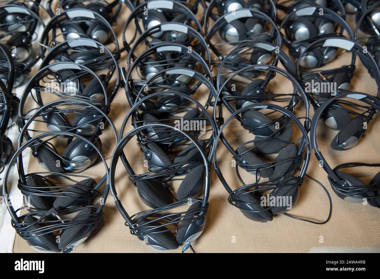 headphones used for simultaneous translation equipment simultaneous interpretation equipment . A set of headphones for simultaneous translation during Stock Photo