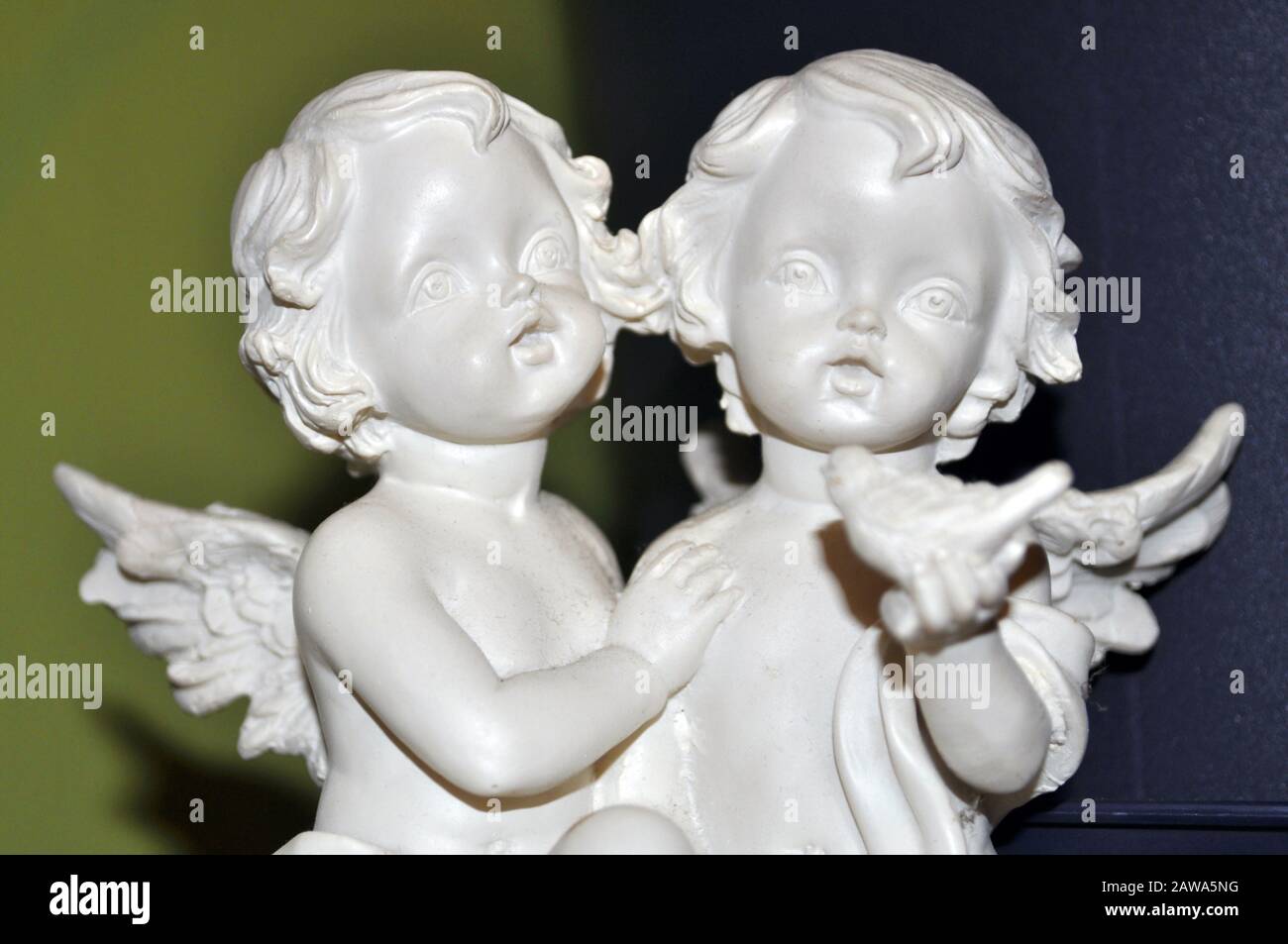 Two small angels praying, closeup Stock Photo