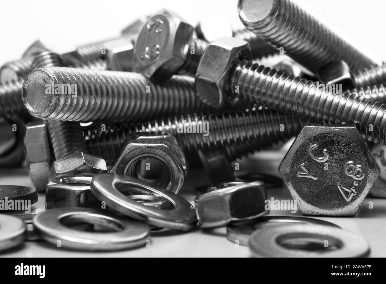 Steel bolts nuts and washers isolated on a white background Stock Photo