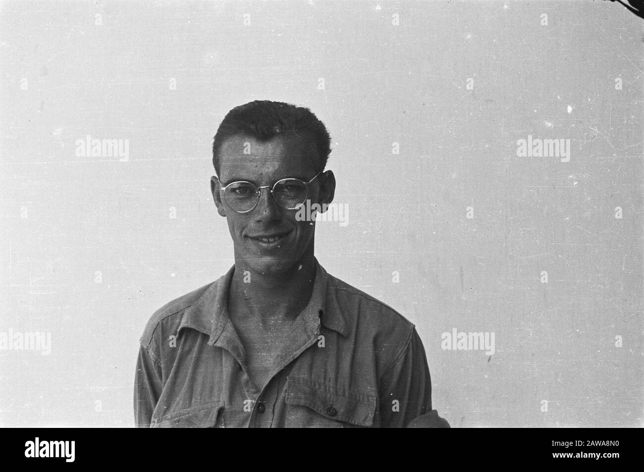 passport photos I  [Man with glasses in shirt without epaulets] Date: 1947 Location: Indonesia Dutch East Indies Stock Photo