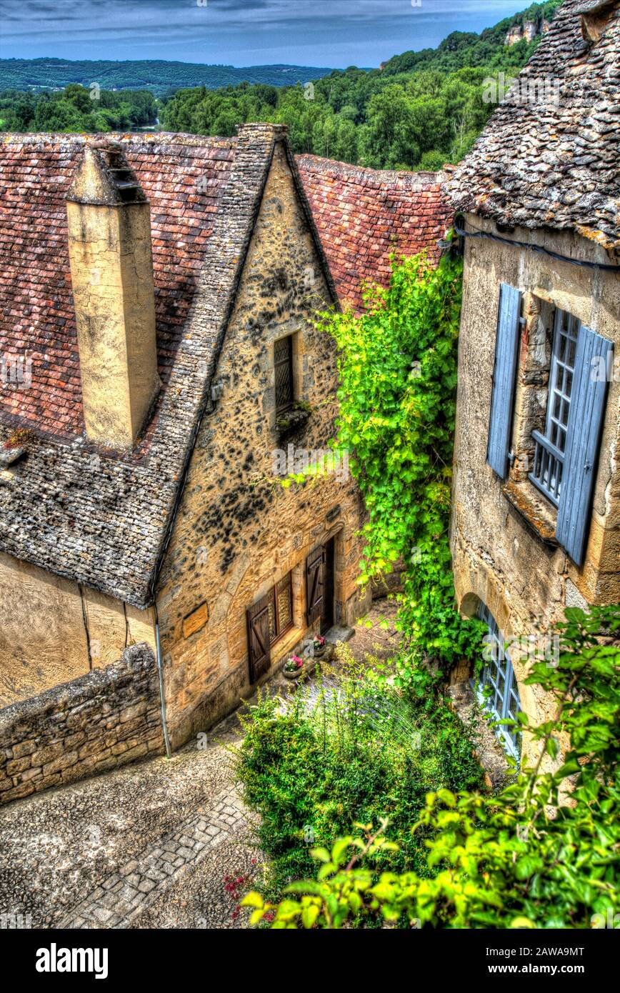 Village of Beynac-et-Cazenac, France. Artistic view of Beynac’s steep cobbled lanes that lead to and from the Chateau de Beynac. Stock Photo