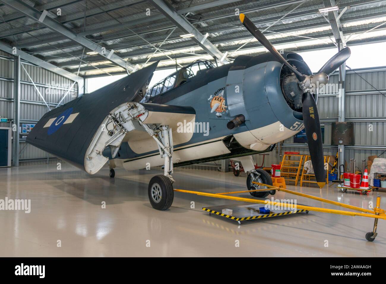 A Grumman TBM Avenger, WWII torpedo bomber in hangar with folded wings, Ohakea, New Zealand. Owned and flown by Brendon Deere. Stock Photo