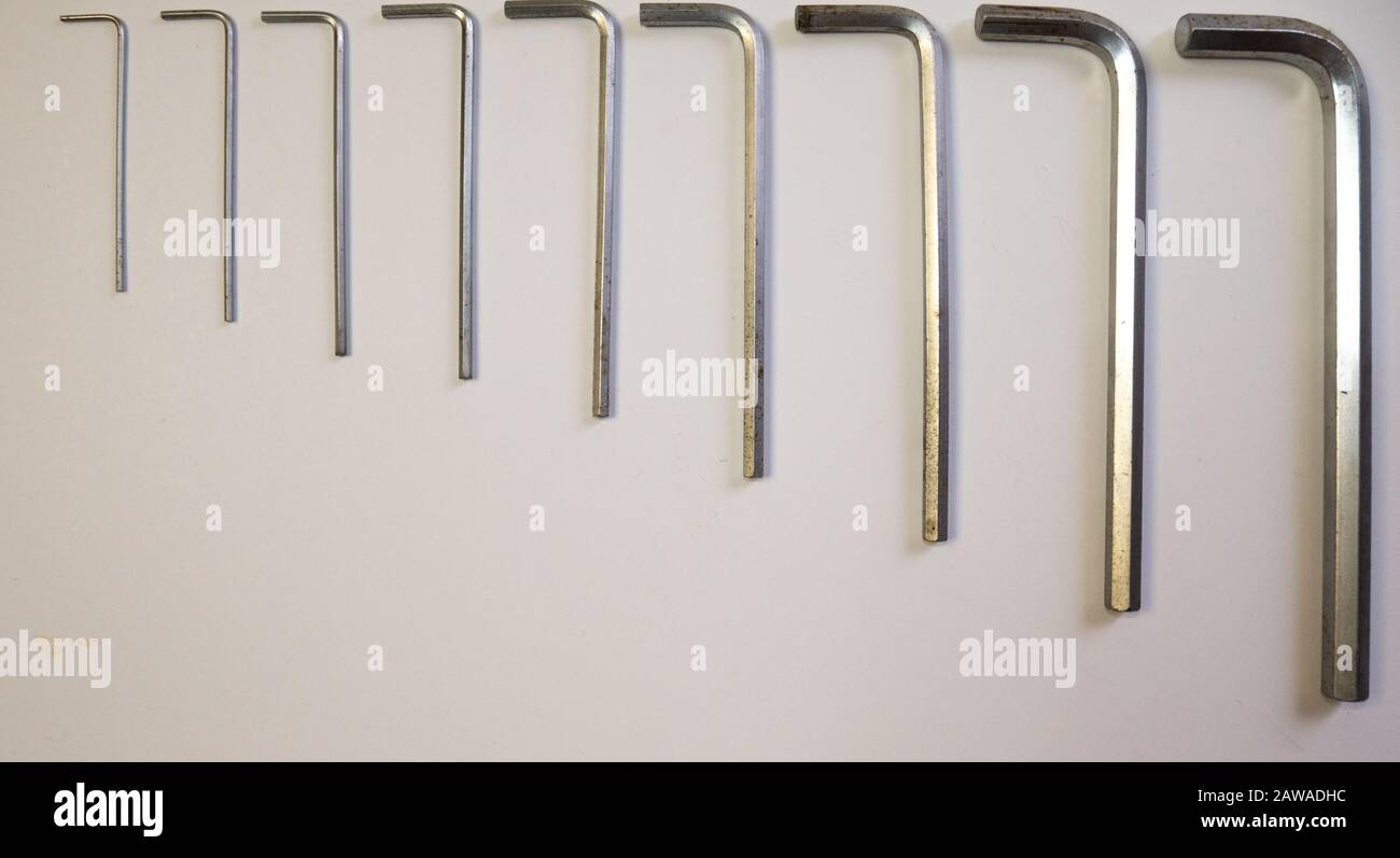 Hexagonal key on a white background. Copy space. Stock Photo