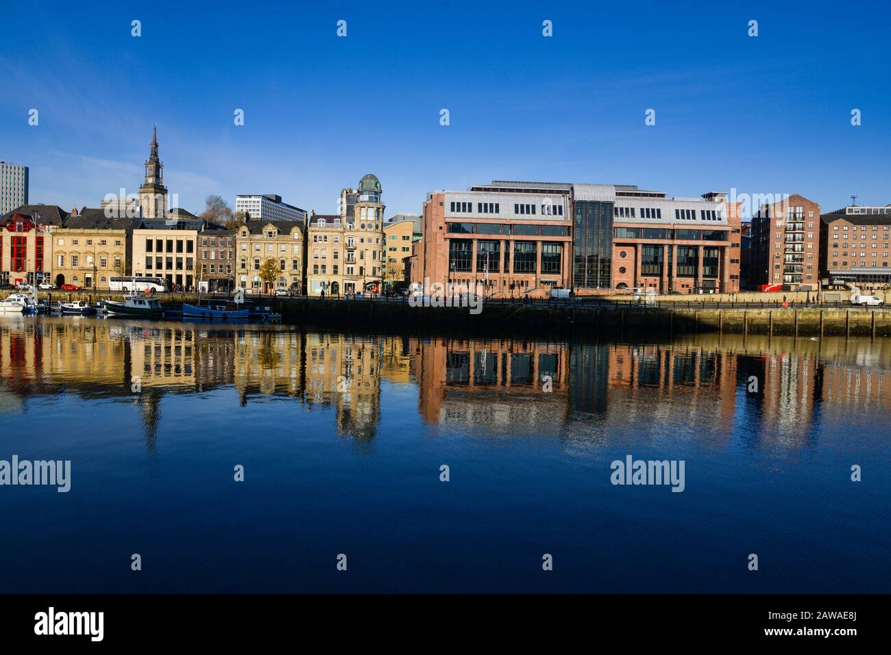 Newcastle Crown Court built out of red sandstone stands out on the Quayside on the north side of the River Tyne Stock Photo