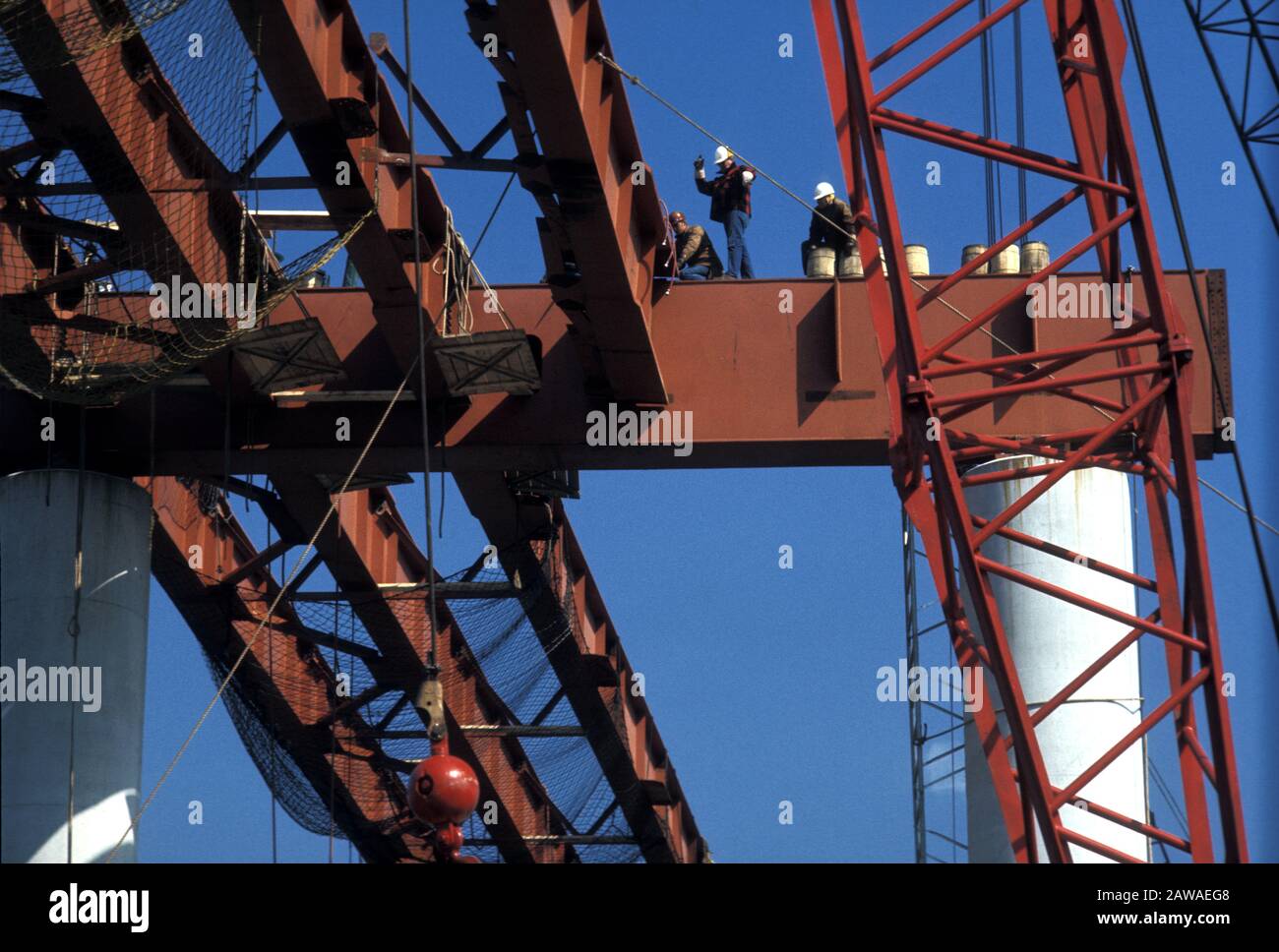 Infrastructure repair as workman install steel girders for a new highway addition Stock Photo