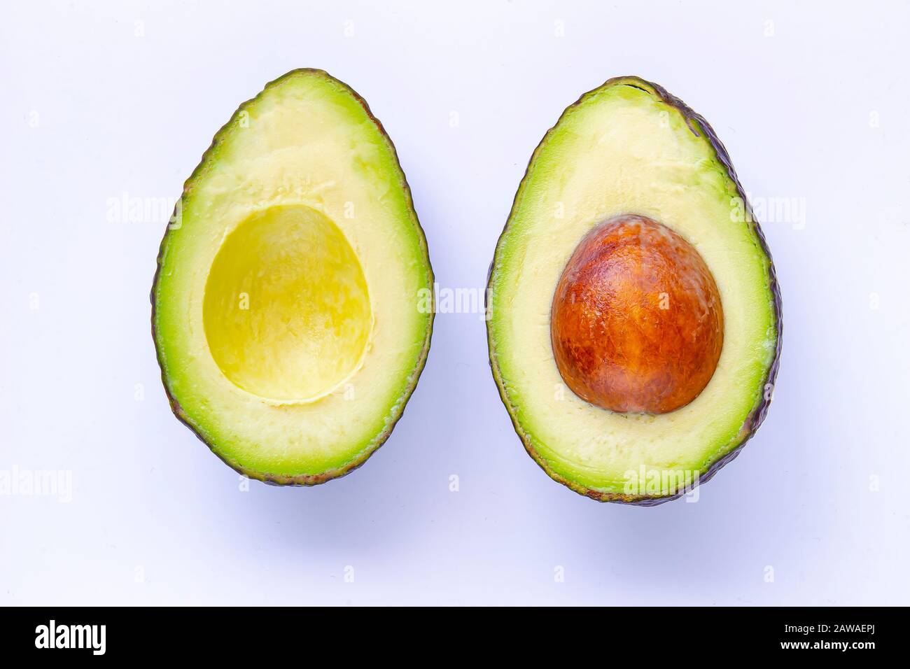 Half avocado Isolated on White Background with soft shadow Stock Photo