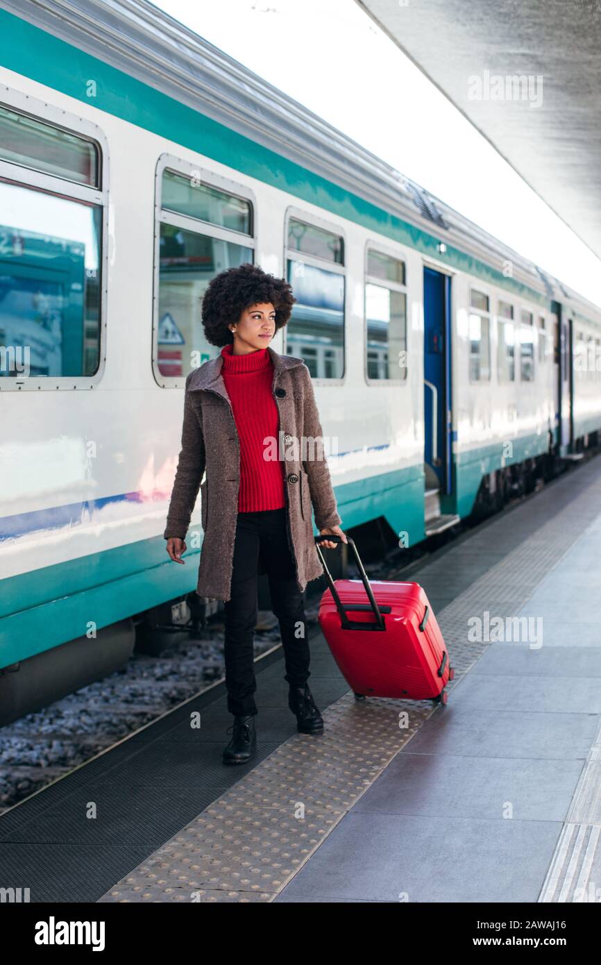 Tourist woman going for vacation trip on train Stock Photo
