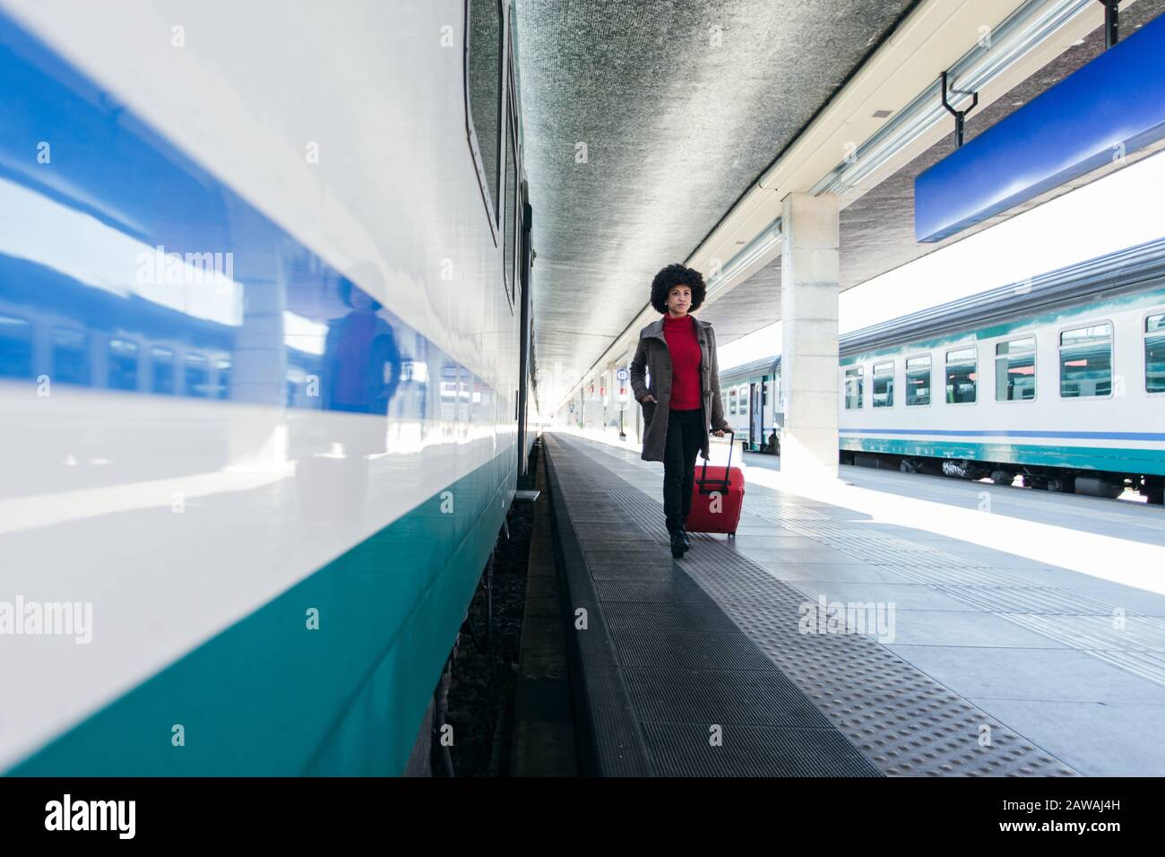 Tourist woman going for vacation trip on train Stock Photo