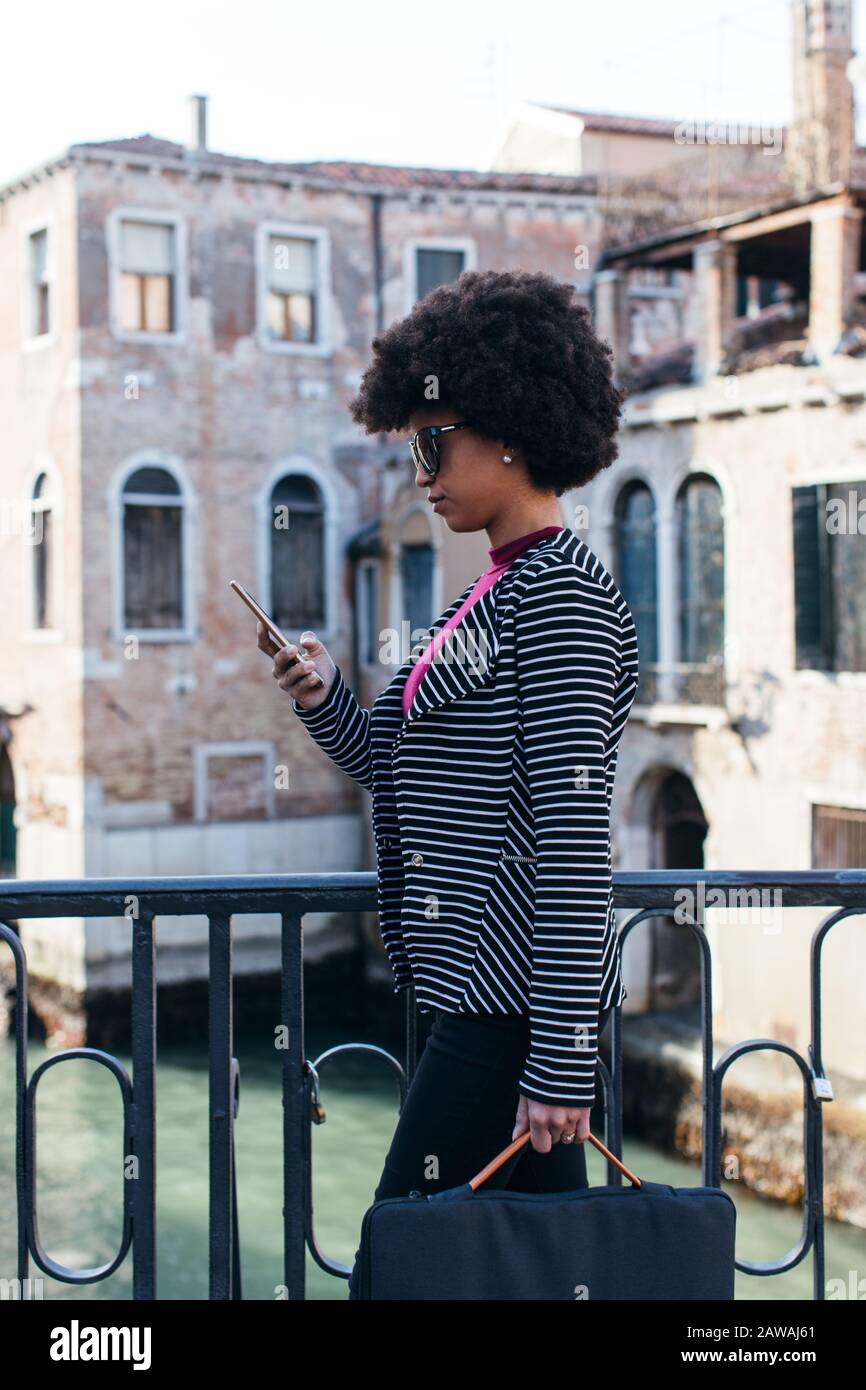 Modern Young Woman Using Smartphone Stock Photo