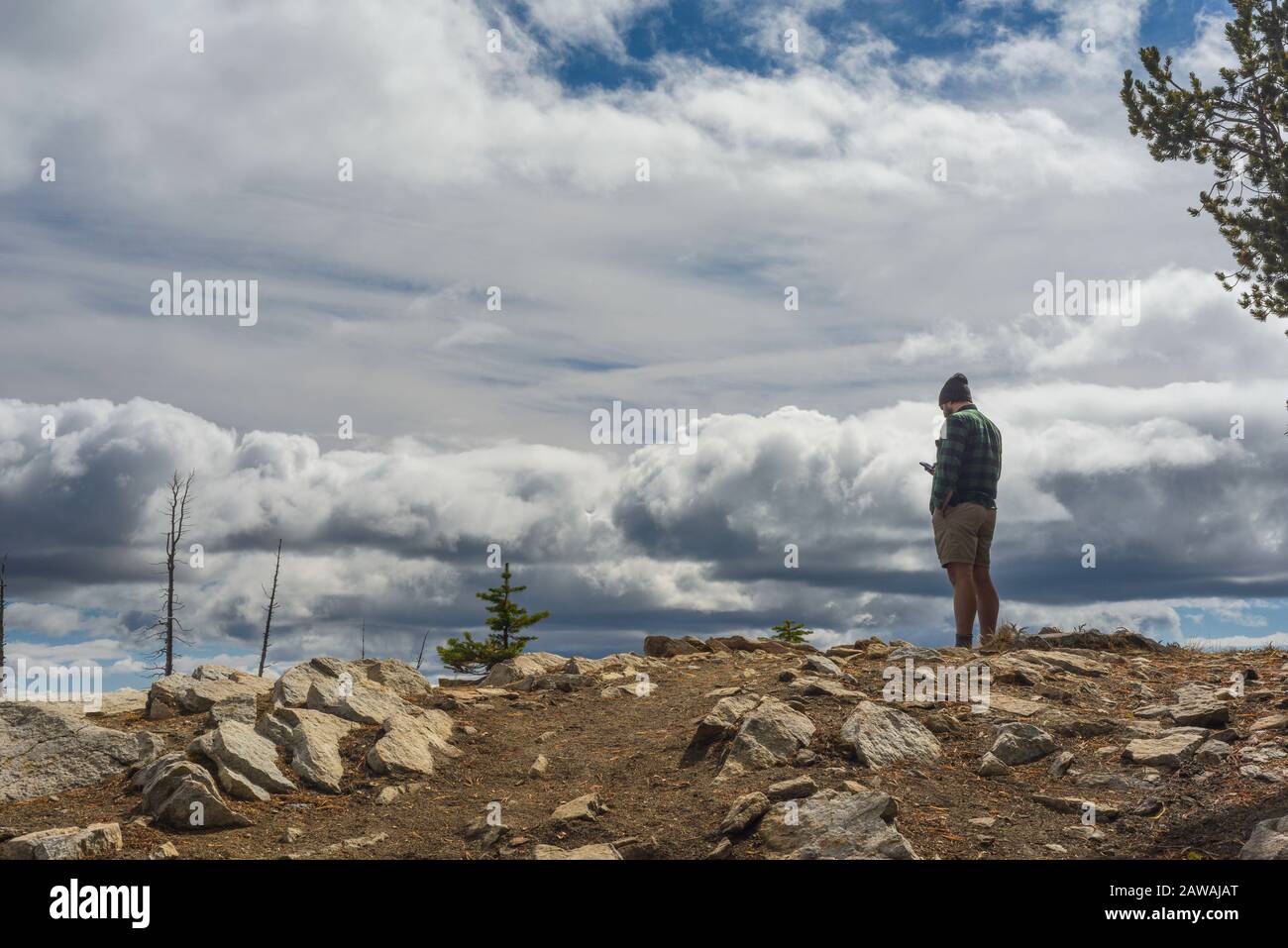 Hiker standing in moody hi-res stock photography and images - Alamy