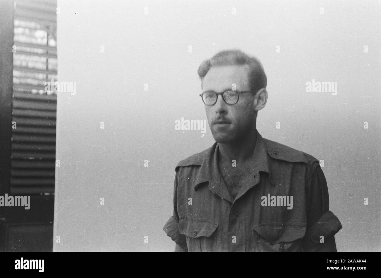 Passport photos VII  [Soldier with glasses and mustache shirt with shoulder epaulets without rank insignia] Date: 01/07/1947 Location: Indonesia Dutch East Indies  :  Unknown / DLC Copyright Holder: National Archives Material Type: Negative (black / white) archive inventory number: see access 2.24.04.03 Stock Photo