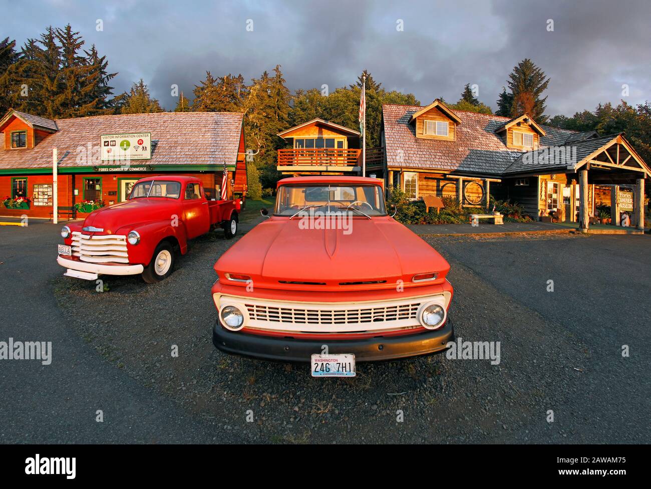 Chevy Trucks In front of the Forks Visitor Center and Timber Museum in Forks Washington. The left truck is a 1953 Chevy, envisioning Bella Swan’s truc Stock Photo