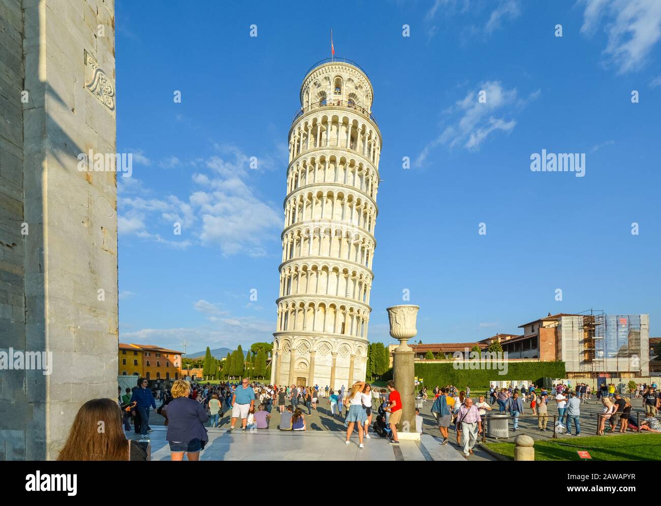 Tourists crowd the busy Piazza dei Miracoli as they view the Leaning Tower in Pisa, Italy. Stock Photo