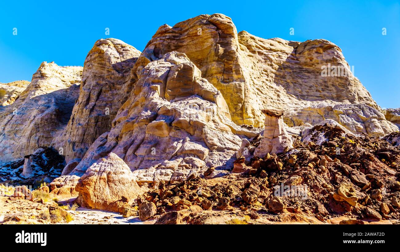 Toadstool Hoodoos against the background of the colorful sandstone mountains in Grand Staircase-Escalante Monument in Utah, Unites States Stock Photo
