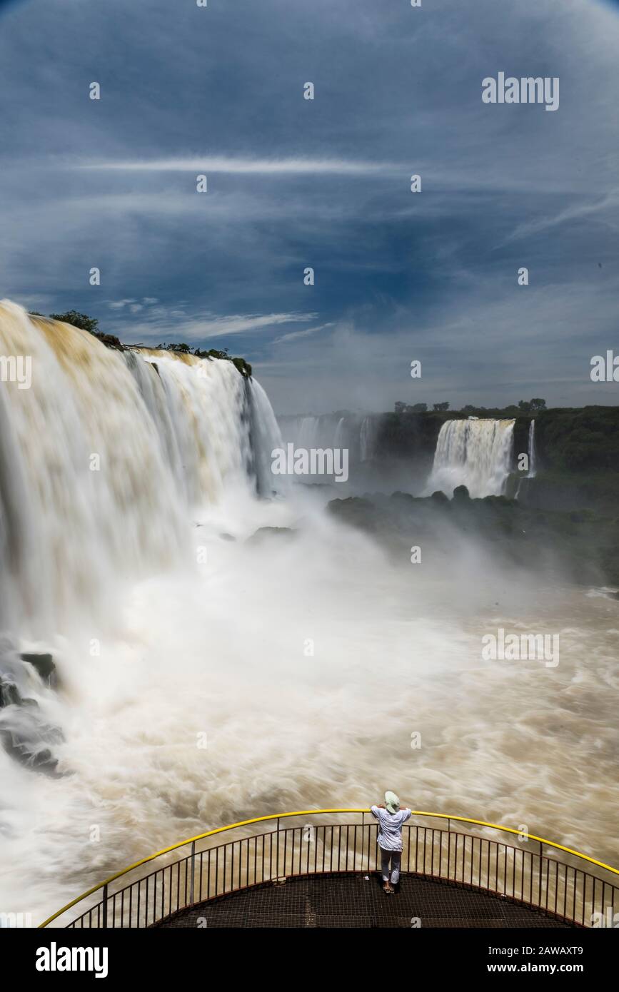 Beautiful long exposure image of tourists looking at Iguazu Falls, Brazil. Stock Photo